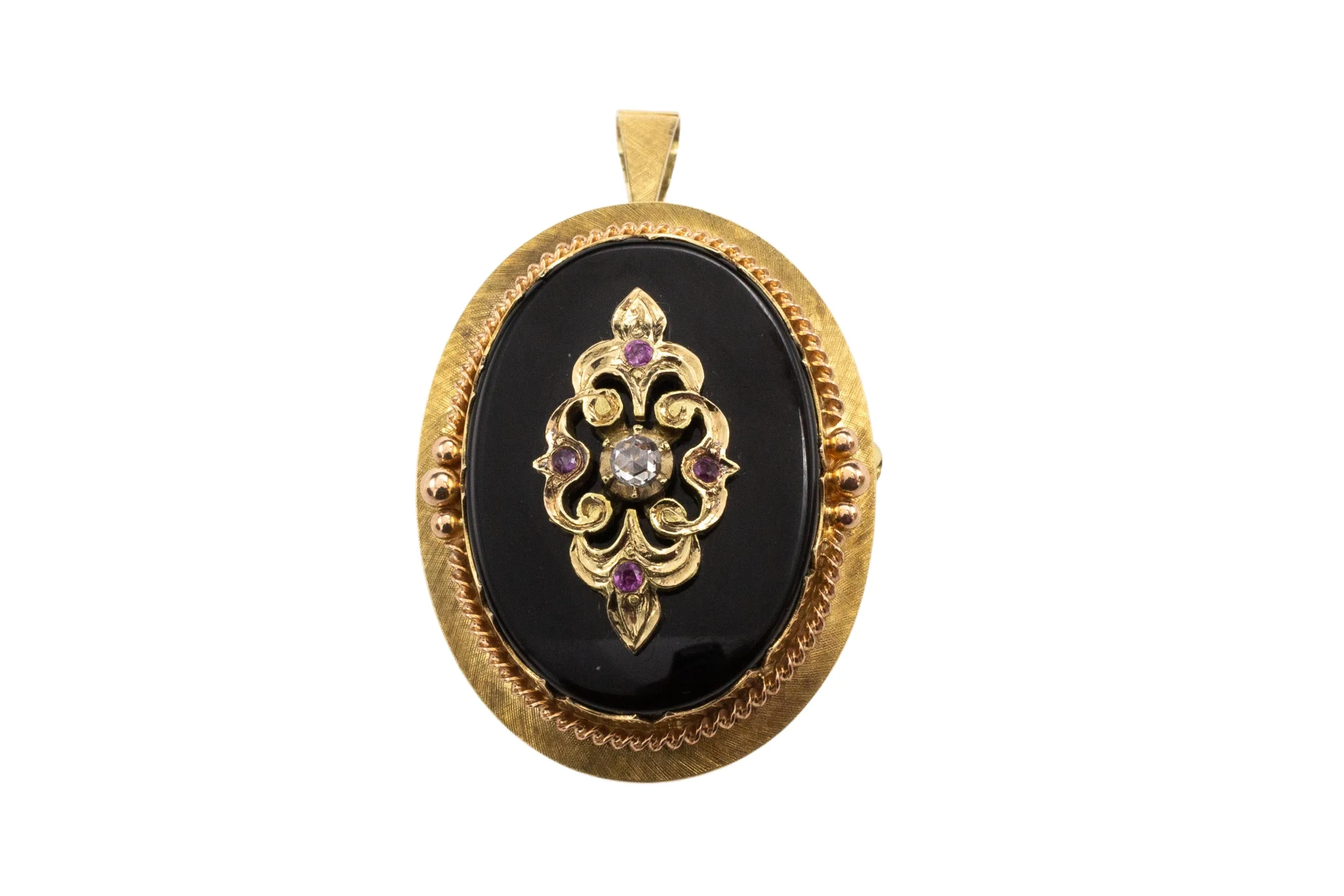 Antique gold pendant or brooch with onyx, a rose diamond and rubies in silver